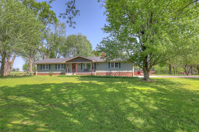ranch-style house with covered porch and a front yard
