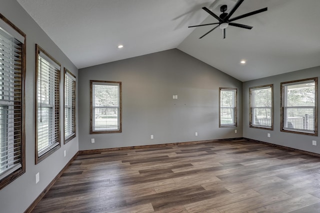 spare room featuring wood finished floors, a ceiling fan, lofted ceiling, and recessed lighting
