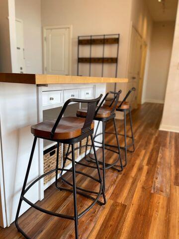 dining space featuring baseboards and wood finished floors