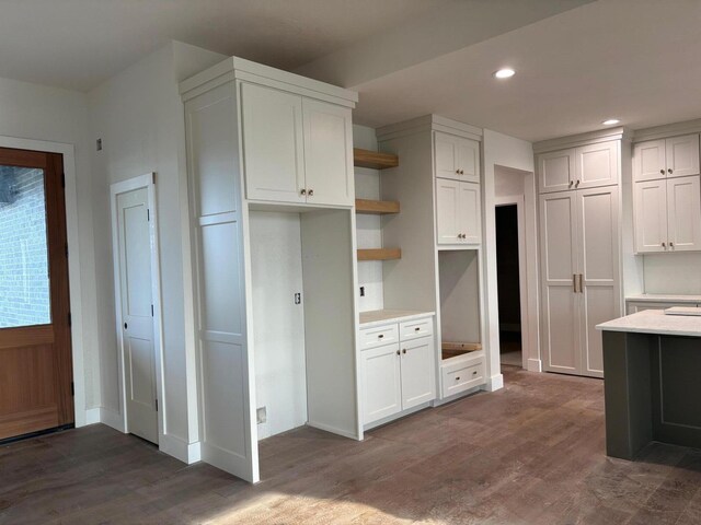 kitchen with recessed lighting, open shelves, baseboards, and dark wood-style floors