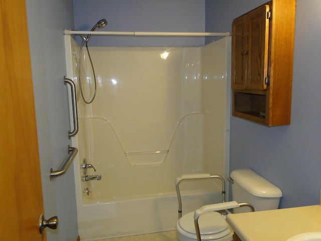bathroom featuring vanity, shower / tub combination, and toilet
