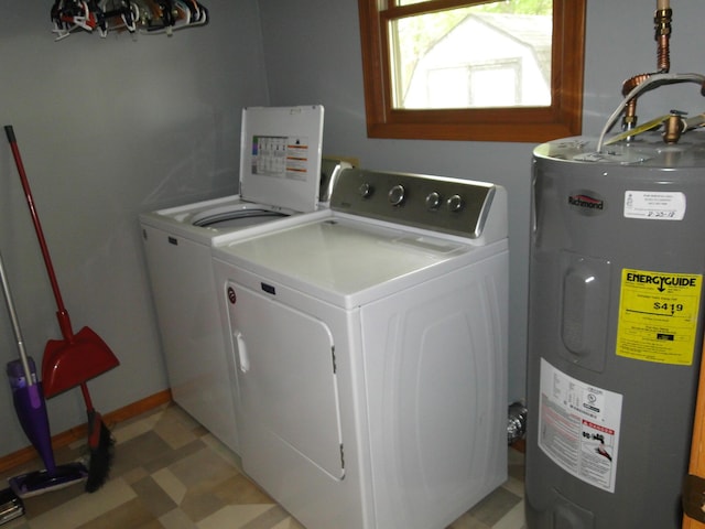 laundry area with laundry area, a chandelier, water heater, light floors, and washer and clothes dryer