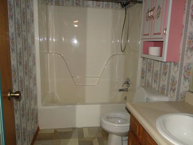 full bathroom featuring vanity, toilet, wallpapered walls, and bathtub / shower combination