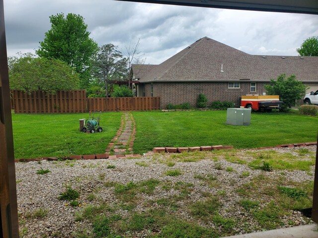 view of yard featuring fence