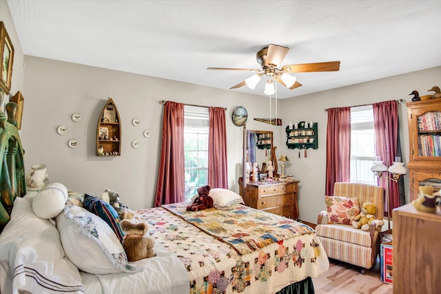 3538 E State Highway Aa, Springfield, MO 65803 - bedroom with multiple windows, light wood finished floors, and ceiling fan