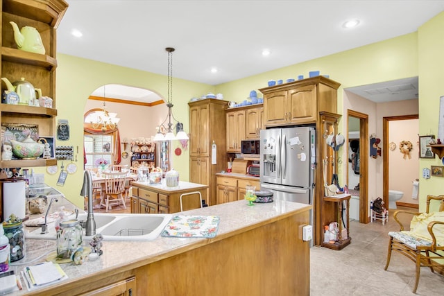 3538 E State Highway Aa, Springfield, MO 65803 - kitchen with stainless steel refrigerator with ice dispenser, light countertops, a sink, pendant lighting, and open shelves