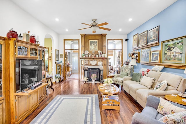 3538 E State Highway Aa, Springfield, MO 65803 - living room with arched walkways, wood finished floors, a fireplace, ceiling fan, and recessed lighting