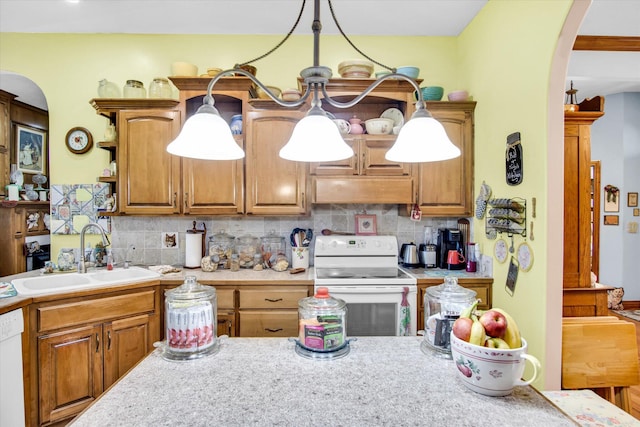3538 E State Highway Aa, Springfield, MO 65803 - kitchen featuring white appliances, a sink, arched walkways, light countertops, and decorative backsplash