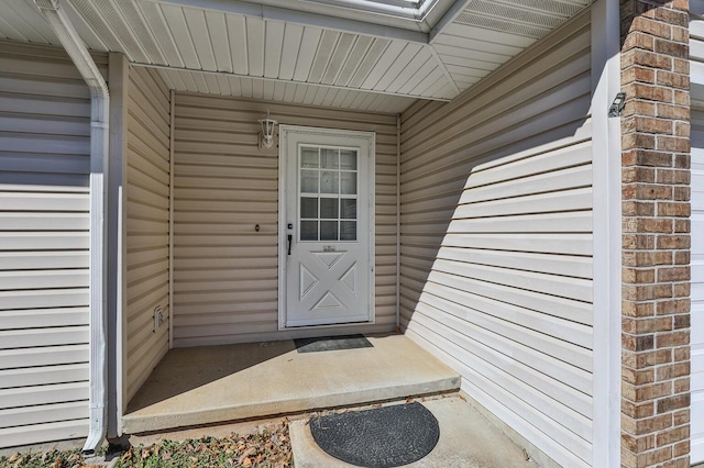 entrance to property with brick siding