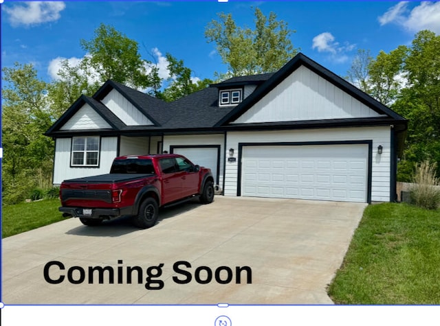 view of front of property with a shingled roof, an attached garage, a front lawn, board and batten siding, and concrete driveway