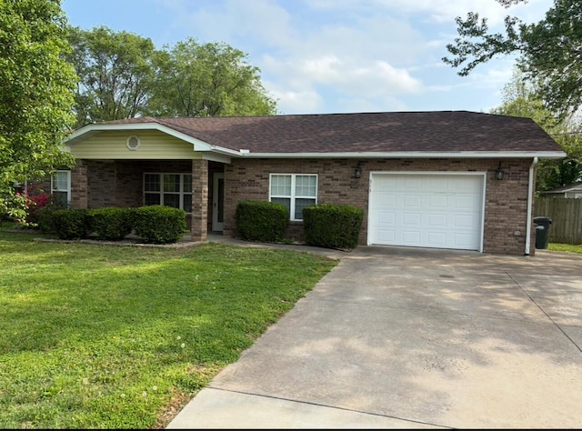 313 W Phelps Ave, Pierce City, MO 65723 - single story home featuring a garage, driveway, a front lawn, and brick siding