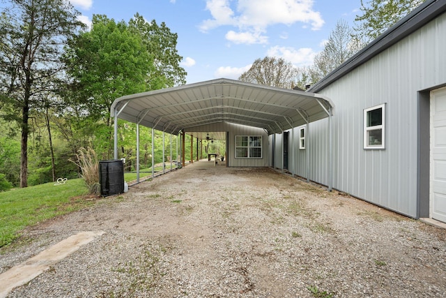 view of parking featuring a detached carport and driveway