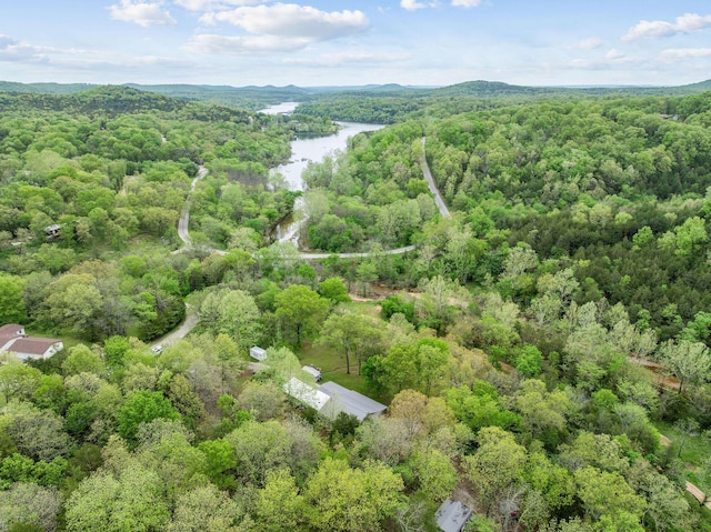 bird's eye view featuring a view of trees and a water view