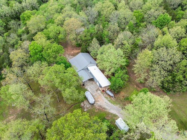 bird's eye view featuring a wooded view