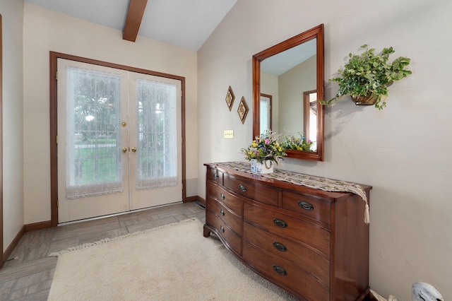 doorway to outside featuring french doors and baseboards