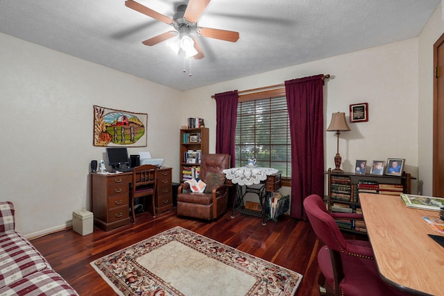 office space featuring wood finished floors, ceiling fan, and baseboards