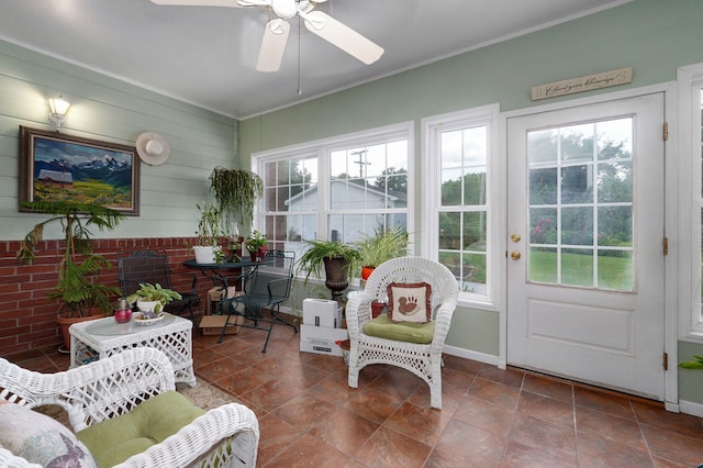 sunroom / solarium featuring french doors, crown molding, and baseboards