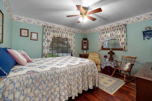 bedroom featuring wood finished floors, ceiling fan, and baseboards