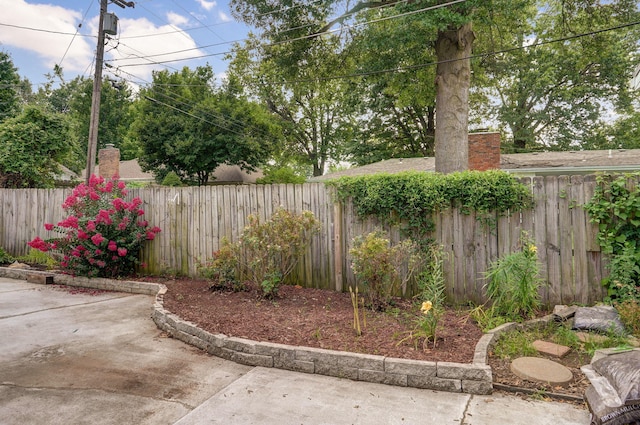 fenced backyard with a patio