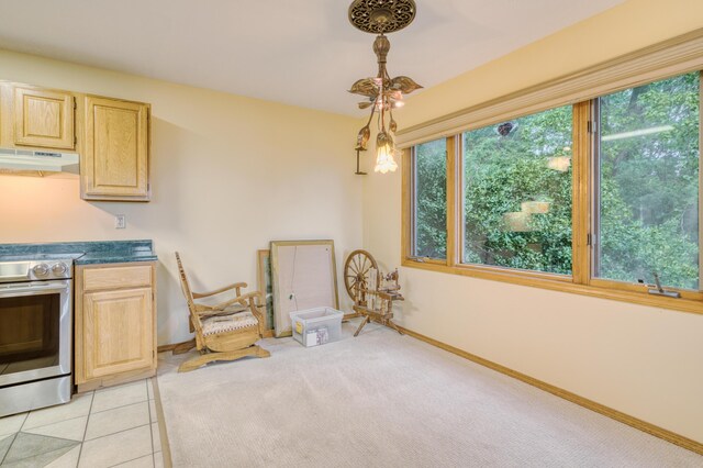 dining area with baseboards and light tile patterned flooring