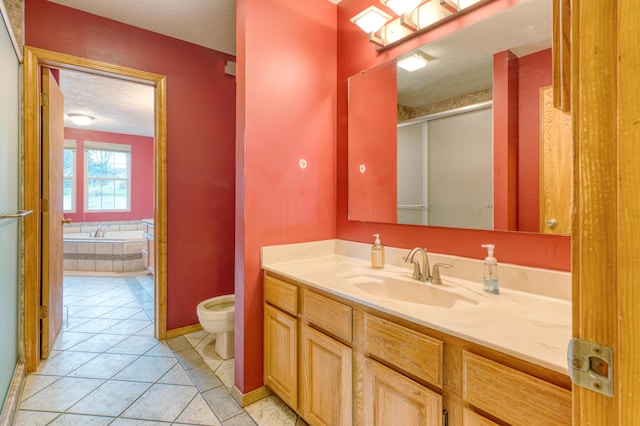 bathroom with tile patterned flooring, vanity, a textured ceiling, a shower stall, and a bath
