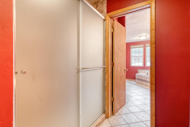 hallway featuring light tile patterned floors