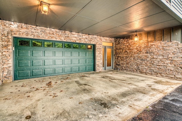 garage with concrete driveway