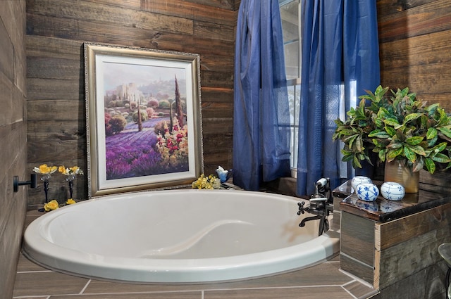 full bathroom with wooden walls and a bath