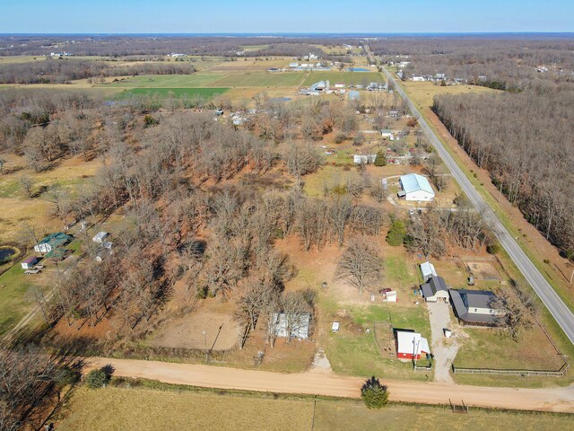 birds eye view of property featuring a rural view