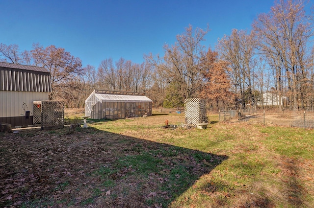 view of yard with an exterior structure and an outbuilding