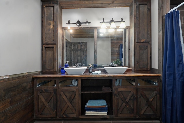 bathroom featuring double vanity and a sink