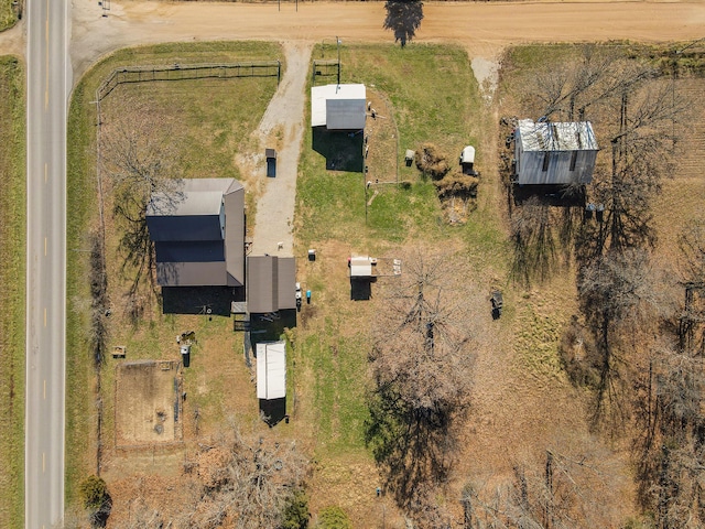 birds eye view of property with a rural view