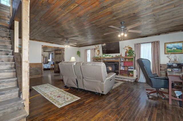 living room featuring wood-type flooring, ceiling fan, and wooden ceiling
