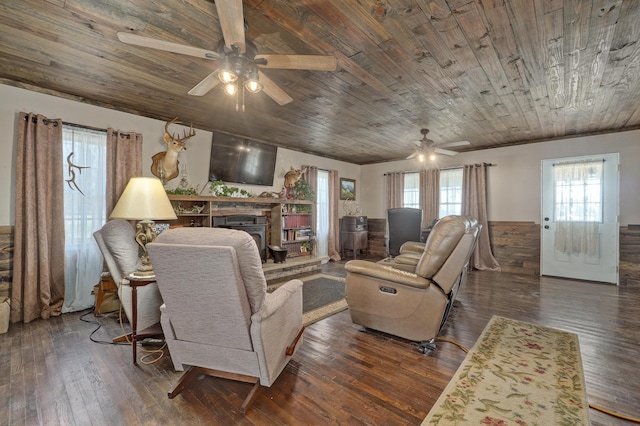 living room with wood ceiling, a fireplace, a ceiling fan, and hardwood / wood-style floors