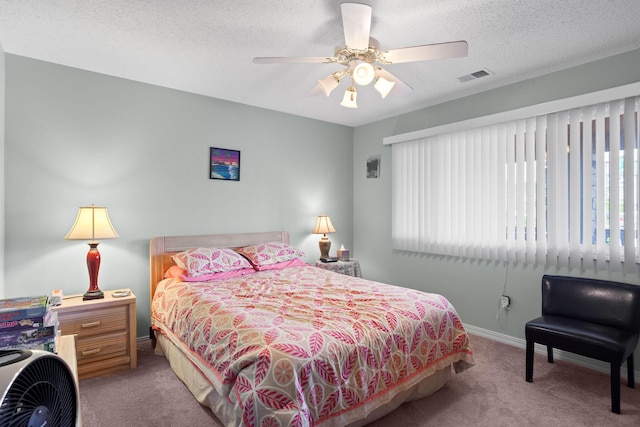 161 Avondale Dr Unit 11, Branson, MO 65616 - bedroom with a ceiling fan, a textured ceiling, visible vents, baseboards, and carpet