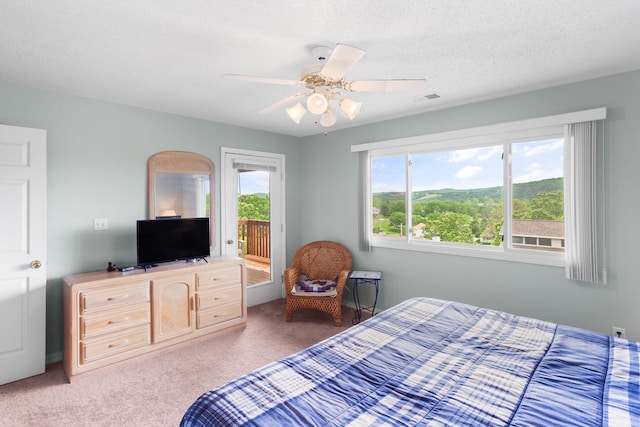 161 Avondale Dr Unit 11, Branson, MO 65616 - bedroom with visible vents, carpet flooring, ceiling fan, and access to outside