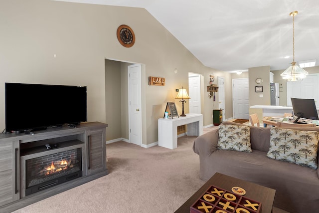 161 Avondale Dr Unit 11, Branson, MO 65616 - carpeted living room featuring a lit fireplace, baseboards, a chandelier, and vaulted ceiling