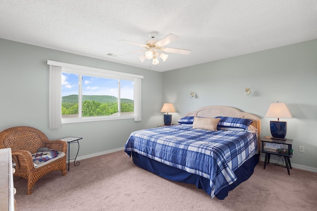 161 Avondale Dr Unit 11, Branson, MO 65616 - bedroom featuring visible vents, baseboards, ceiling fan, a textured ceiling, and carpet