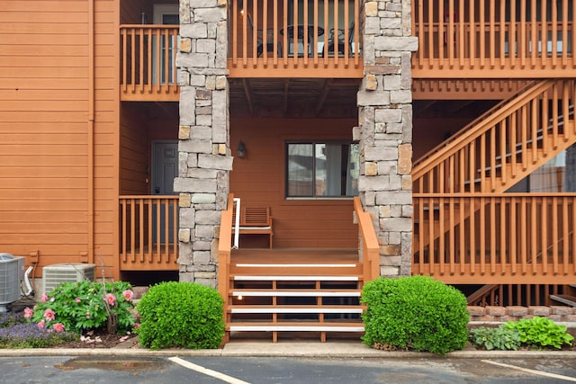 161 Avondale Dr Unit 11, Branson, MO 65616 - exterior space featuring uncovered parking, central AC, and stairway