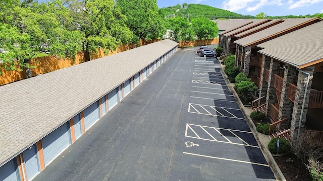 161 Avondale Dr Unit 11, Branson, MO 65616 - exterior space with shuffleboard, uncovered parking, and community garages