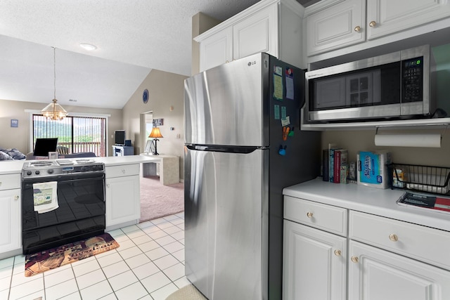 161 Avondale Dr Unit 11, Branson, MO 65616 - kitchen with vaulted ceiling, stainless steel appliances, white cabinetry, and open floor plan