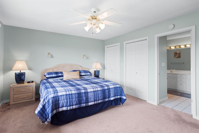 161 Avondale Dr Unit 11, Branson, MO 65616 - bedroom with ceiling fan, baseboards, two closets, connected bathroom, and carpet
