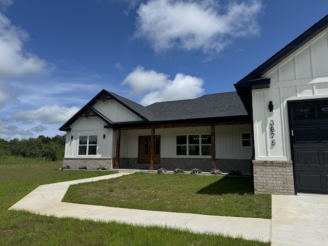 3875 E Dehaven Ln, Fair Grove, MO 65648 - modern farmhouse featuring a front lawn, board and batten siding, and a shingled roof