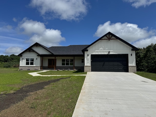3875 E Dehaven Ln, Fair Grove, MO 65648 - modern farmhouse style home with a garage, board and batten siding, a front yard, driveway, and a shingled roof