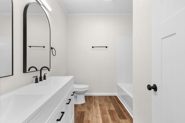 1626 W Lee St, Springfield, MO 65803 - full bath featuring toilet, a sink, ornamental molding, and wood finished floors