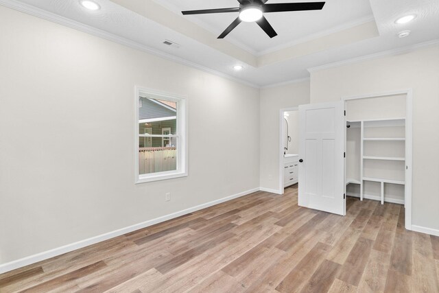 1626 W Lee St, Springfield, MO 65803 - unfurnished bedroom with crown molding, light wood finished floors, recessed lighting, a tray ceiling, and visible vents