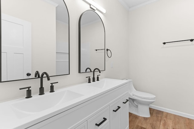1626 W Lee St, Springfield, MO 65803 - bathroom with a sink, crown molding, toilet, and wood finished floors