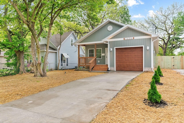 1626 W Lee St, Springfield, MO 65803 - view of front of property with a porch, an attached garage, fence, and concrete driveway