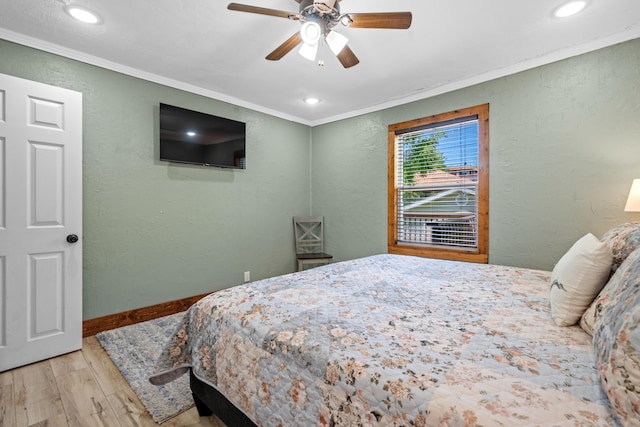bedroom featuring recessed lighting, a textured wall, ornamental molding, and wood finished floors