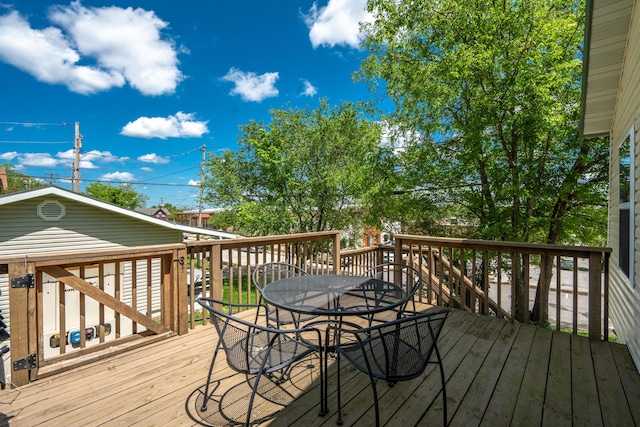 wooden deck with outdoor dining area
